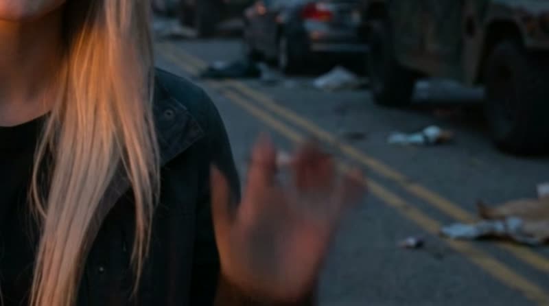A malformed hand in a generated video clip, fingers fused and miscounted